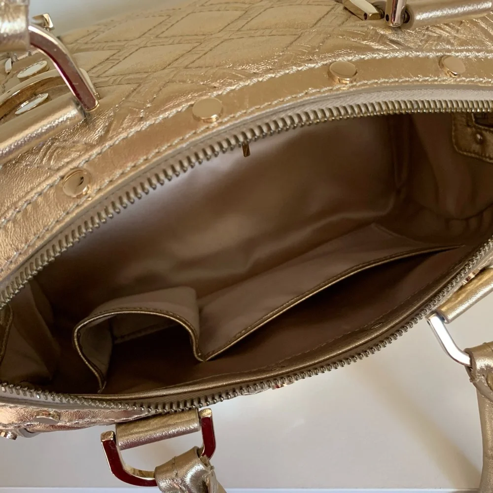 Hold Versace gold quilted handbag